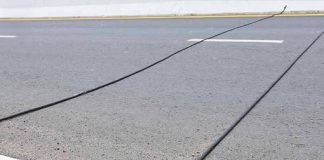 SPOTTED BLACK CABLES ON THE ROAD? HERE’S WHAT THEY ACTUALLY DO (AND WHAT YOU SHOULD NEVER DO)