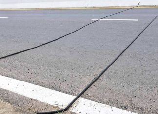 SPOTTED BLACK CABLES ON THE ROAD? HERE’S WHAT THEY ACTUALLY DO (AND WHAT YOU SHOULD NEVER DO)